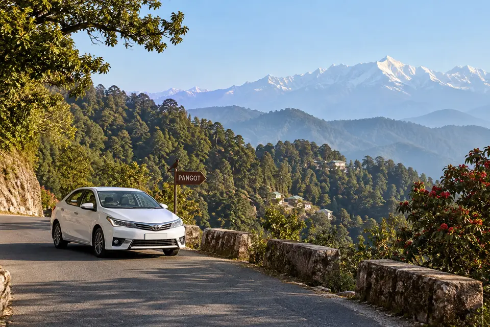 Delhi to Pangot car rental with driver